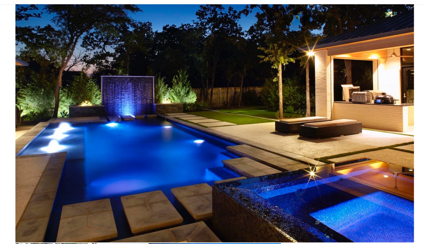 Contemporary Gallery Garden pool with illuminated water wall at dusk - luxury landscape design by Original Landscape Concepts in Southlake, Texas