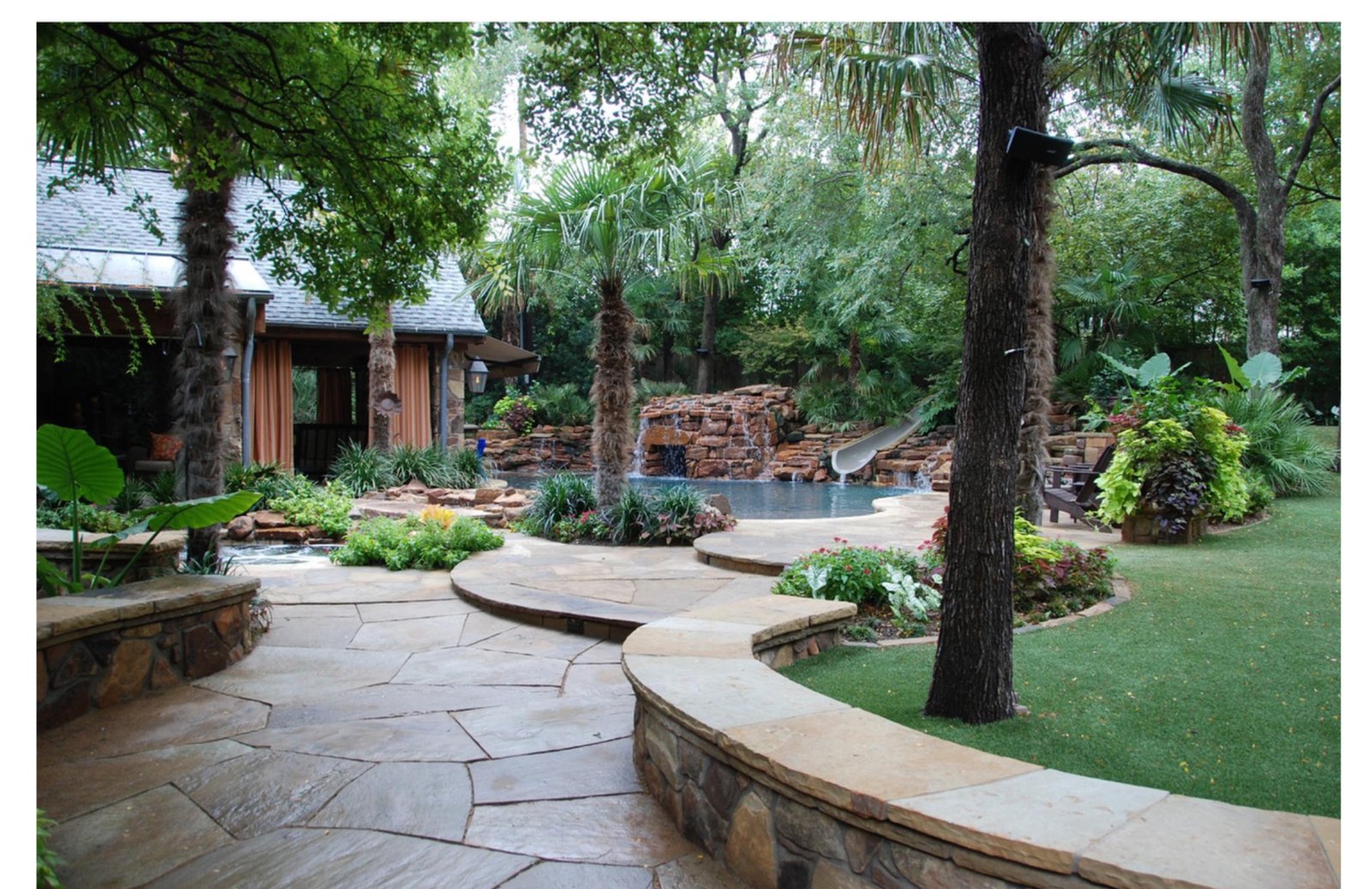 Deep Shade Garden Retreat flagstone patio and waterfall - luxury landscape design by Original Landscape Concepts in North Dallas