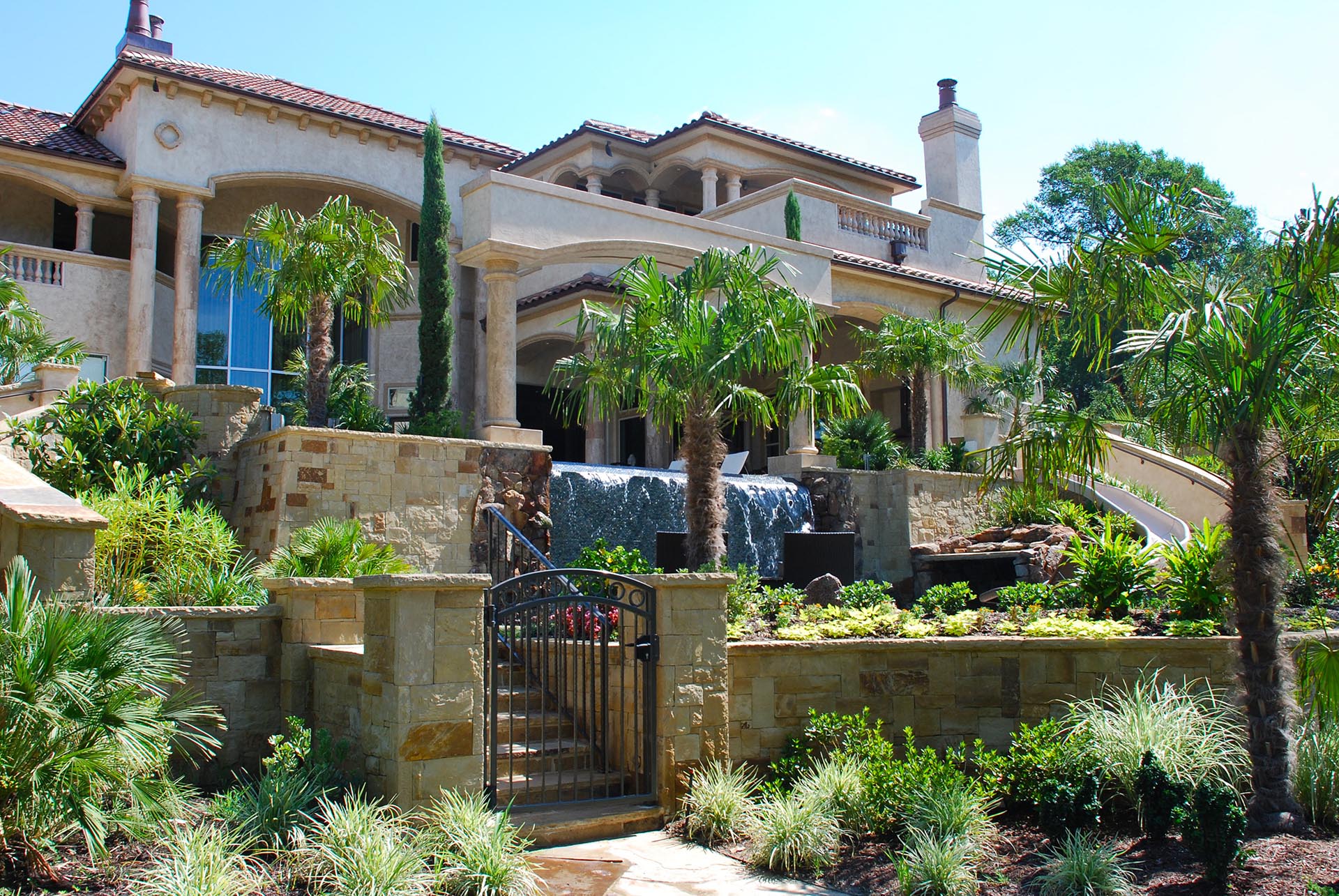 Mediterranean estate negative edge pool tropical landscape in Dallas