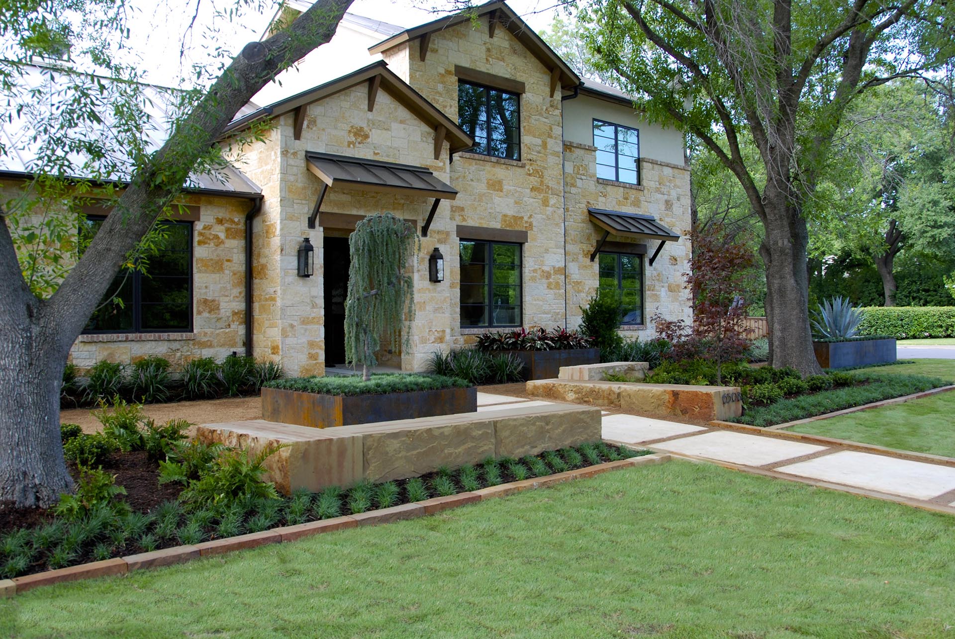 Modern Hill Country front landscape with quarry stone in Dallas by landscape architect