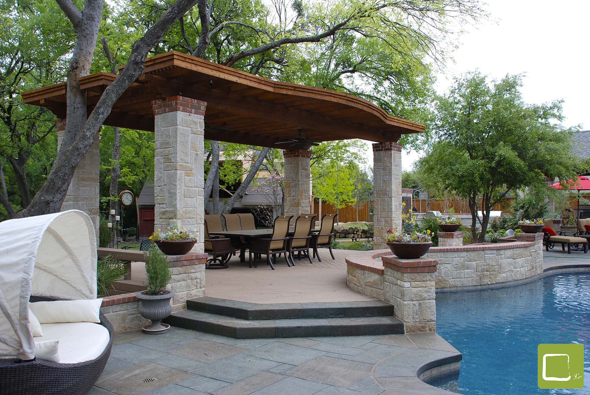 Transitional pool courtyard with arbor stone in Dallas by landscape architect