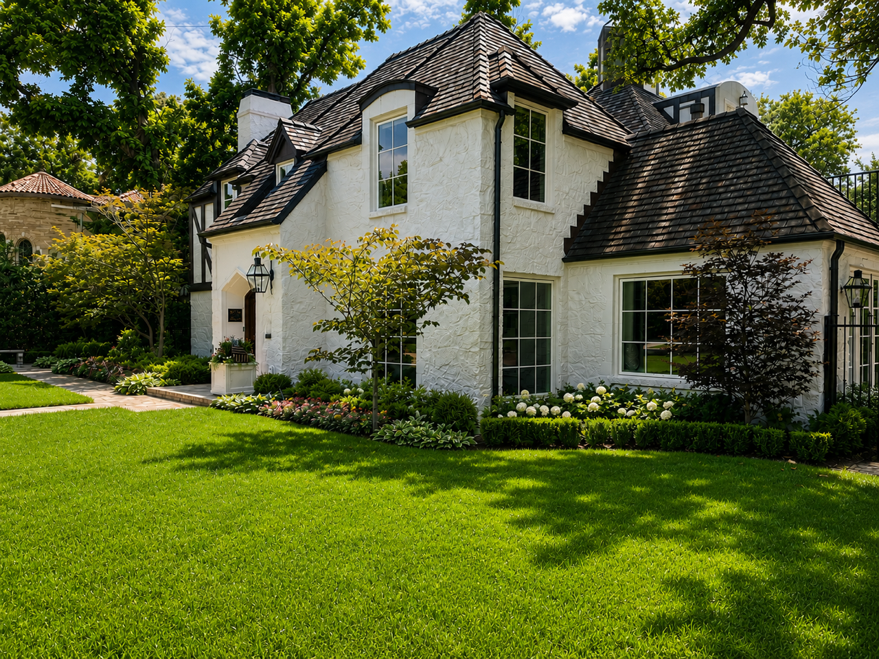 Historic Tudor Revival Garden in Dallas’ Lakewood Conservation District - corner lawn and foundation garden - luxury estate landscape design in Lakewood, Dallas