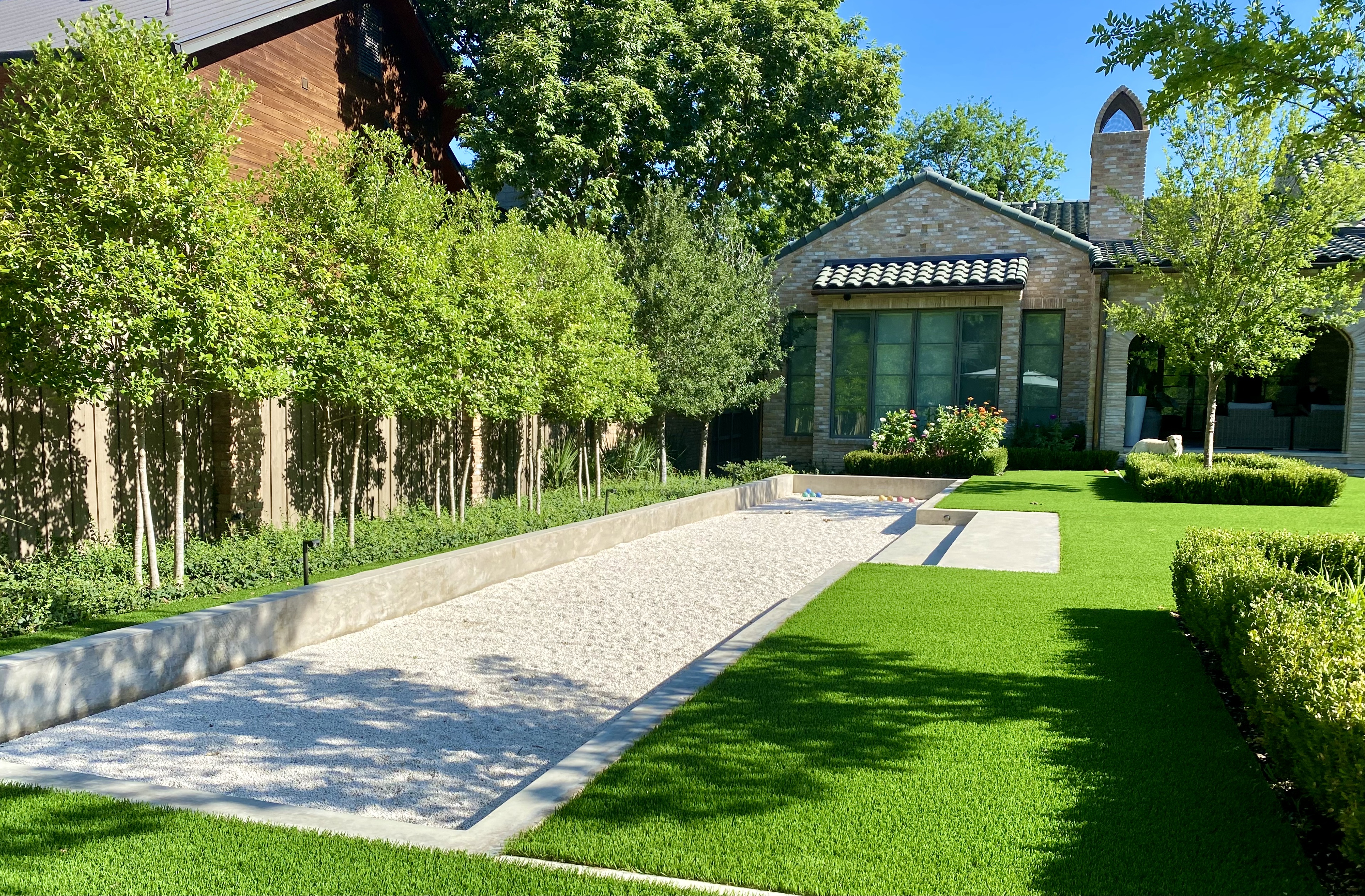 Lakewood estate back yard with bocce court pool in Dallas